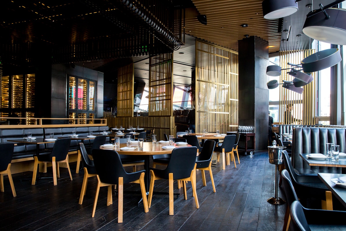 Full-service restaurant dining room with table settings