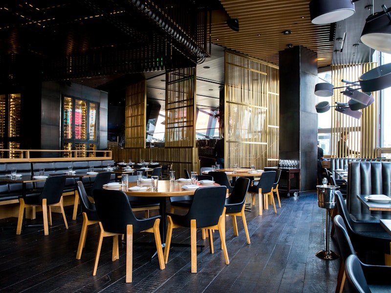 Full-service restaurant dining room with table settings